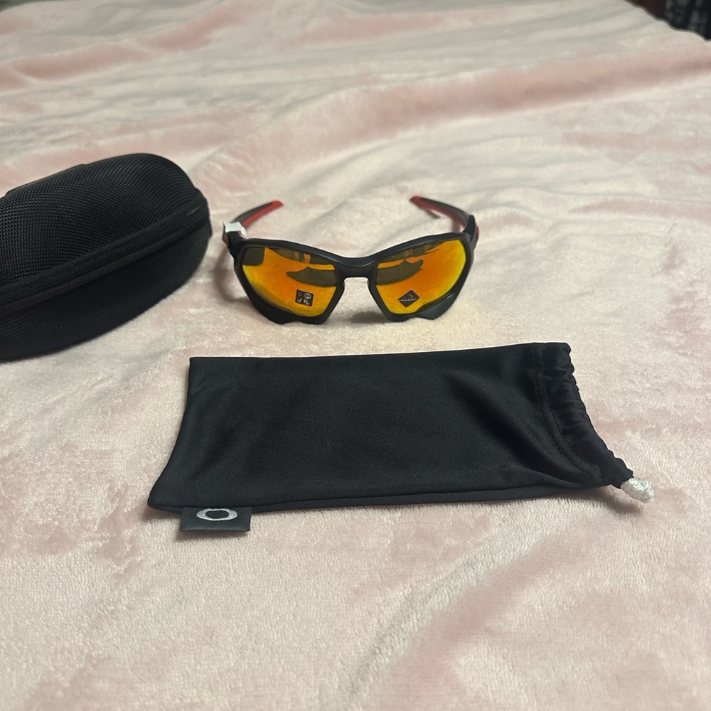 Oakley Black Frame Sunglasses with Orange Lenses